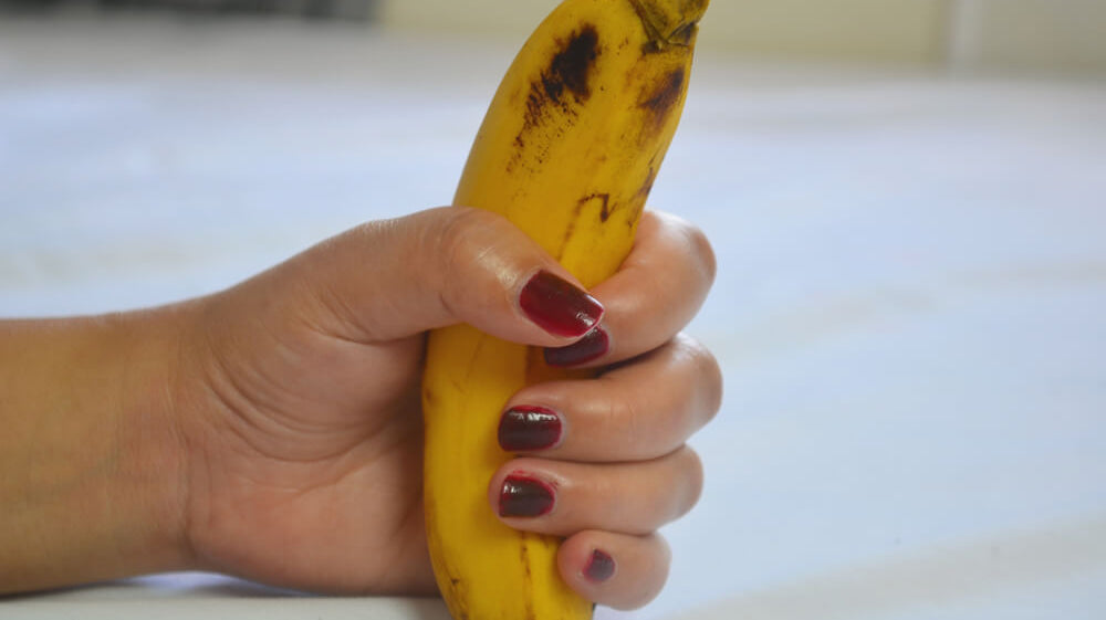 Woman holding banana