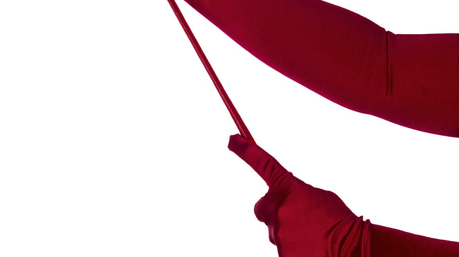 women holding spanking crop