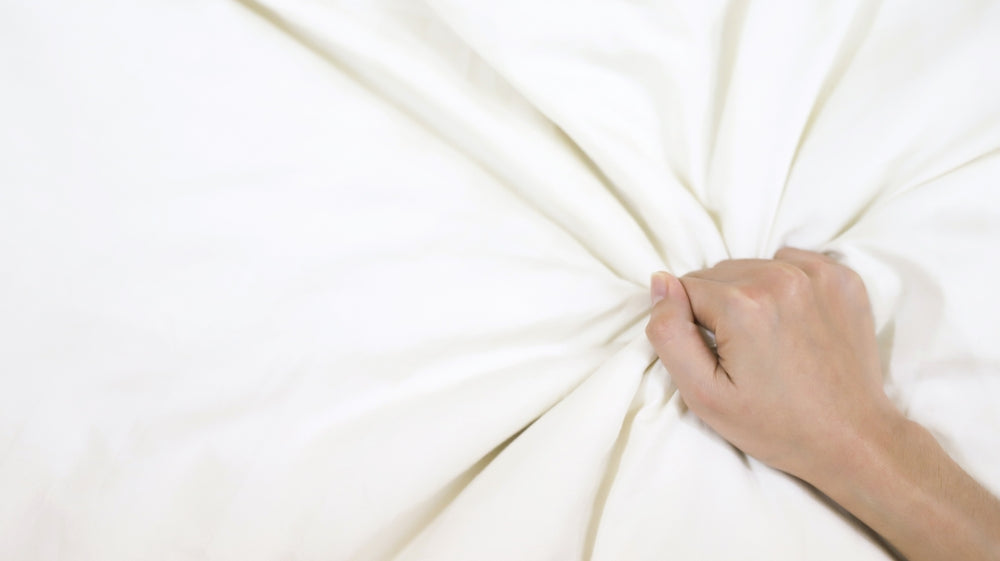 grabbing sheets, reaching orgasm