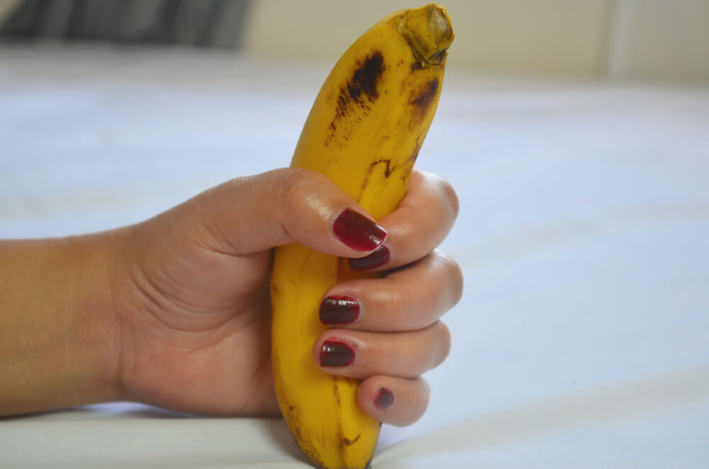 Woman holding banana