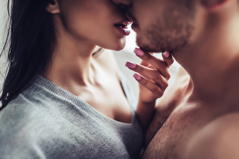 man and woman kissing