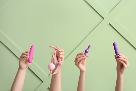 women holding sex toys