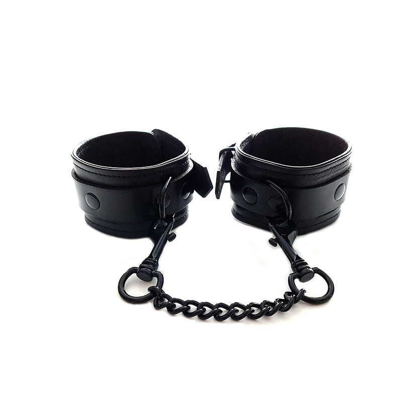 Black Wrist Cuffs by Rouge Garments.