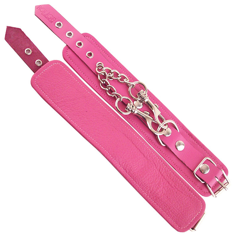 Pink wrist cuffs by Rouge Garments.
